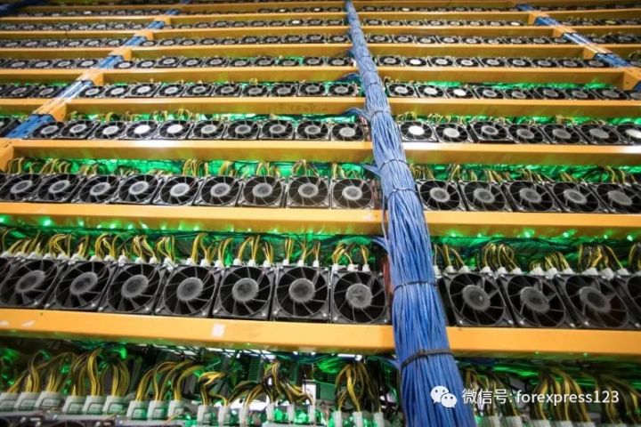 Expansive wind-powered mining farm with rows of active rigs
