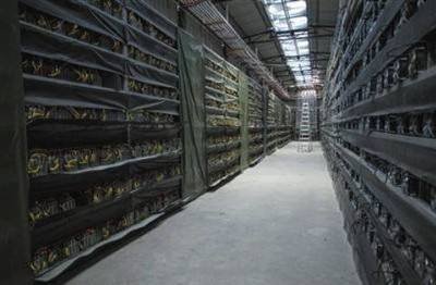 A large-scale cryptocurrency mining farm with rows of ASIC miners in industrial environment